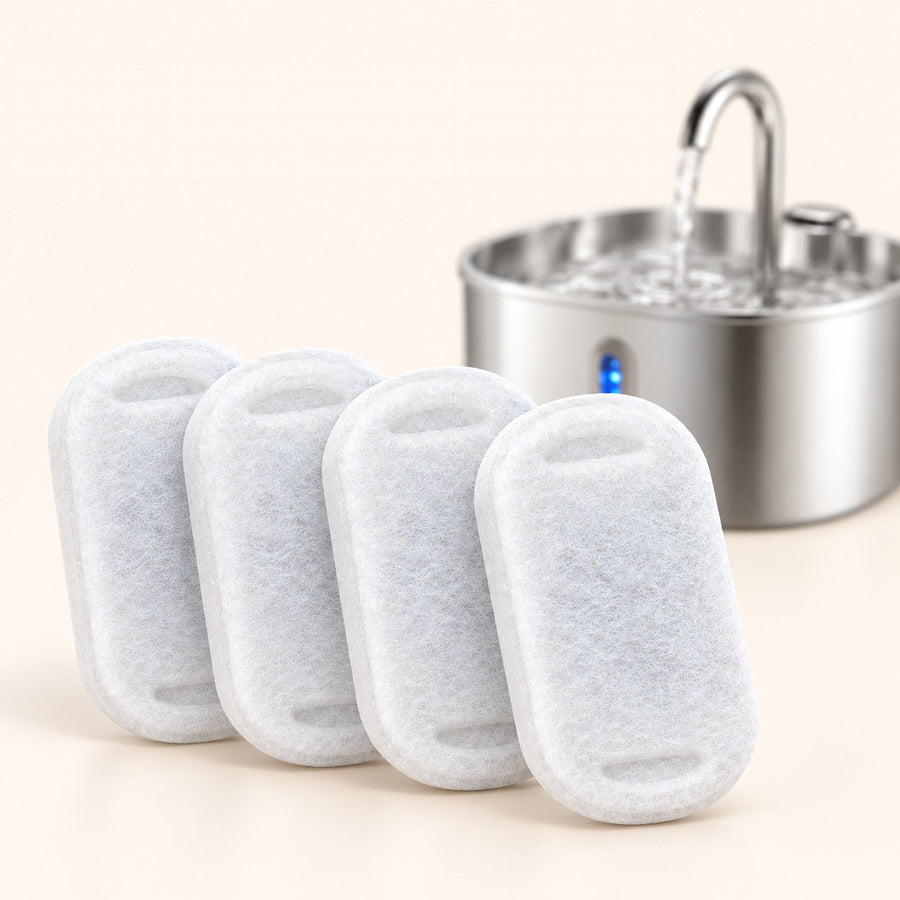 Four WoofWell replacement filter pads in front of the fountain